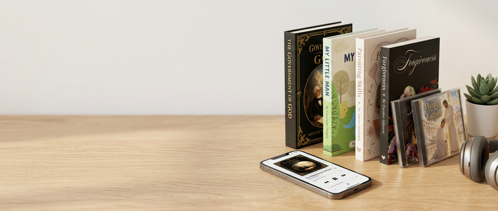 Books, music albums and a phone playing an audiobook from several storefronts, on a desk